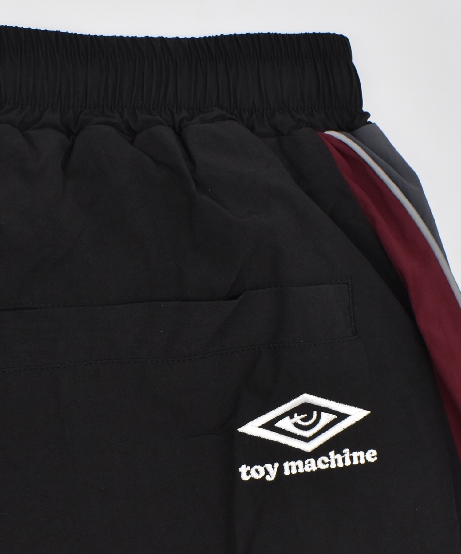 【予約販売】UMBRO アンブロ × TOY MACHINE トイマシーン コラボ トラックパンツ メンズ セットアップ対応 MD3726FWMSPT02 ムラサキスポーツ限定(BLACK-S)