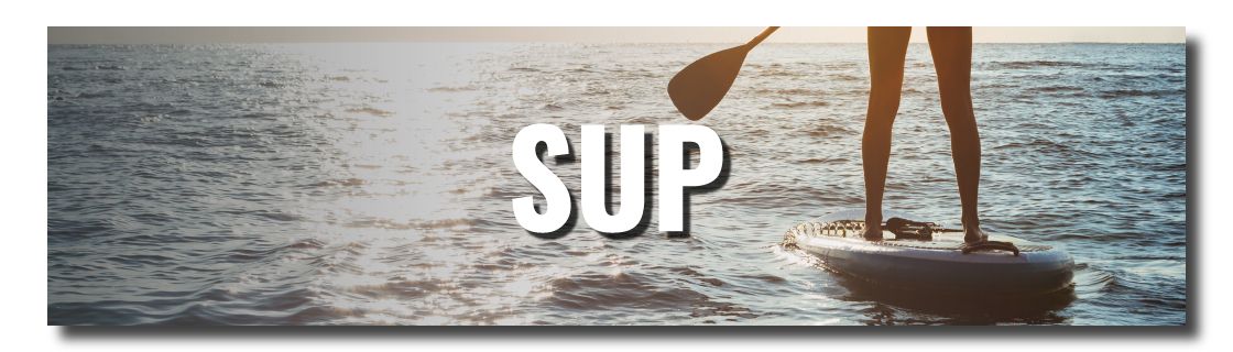 Stand-up paddleboarder on a board on the ocean, paddle raised, with the word 'SUP' over the water in the scene (sunset glow).