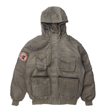 Hooded olive-gray field jacket with four front pockets and a circular patch on the left sleeve.