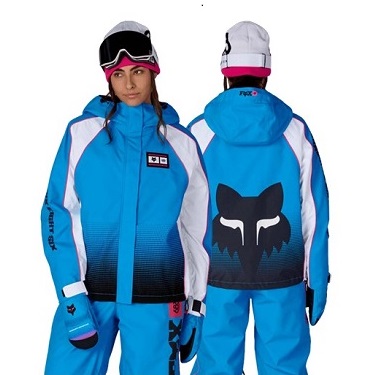 Fox Racing 97 Jacket - SHOP NEWS | ムラサキスポーツオンラインストア 通販 Two people in matching blue and white ski outfits, front person facing the camera wearing goggles; back person shows large Fox logo on the back of the jacket and hooded suit