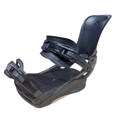 Black snowboard binding with ankle and toe straps, shown from side with highback and base plate