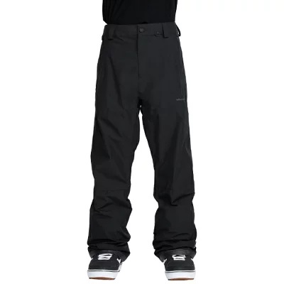 Black ski/snow pants shown from the waist down, with a baggy fit and tucked-in sneakers.