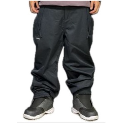 Lower half of a person wearing black cargo pants with elastic cuffs, paired with black sneakers.