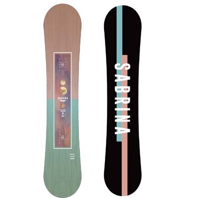 VOYAGE - SHOP NEWS | ムラサキスポーツオンラインストア 通販 Two snowboards standing upright side by side: the left board has a wood-grain finish with a framed graphic in the center; the right board is black with a pale pink vertical stripe and the word'SABRINA' written along the stripe in white.