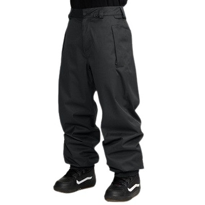 Person wearing black baggy pants tucked into black Nike sneakers, shown from the waist down (informative clothing image).","Lower-body view of a person in oversized black pants with black Nike sneakers.","Black loose-fitting pants with cuffs over black Nike shoes, viewed from the feet up to mid-shins."