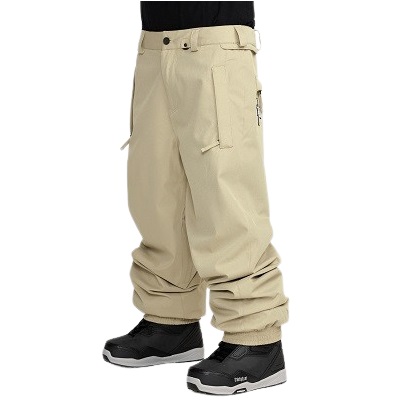 Beige cargo pants with multiple pockets and cinched, tucked-in cuffs worn with black sneakers