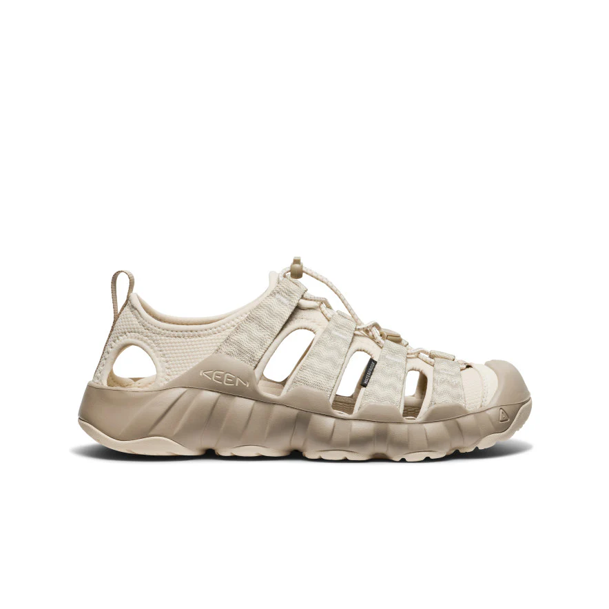 Beige Keen outdoor sandal with multiple straps and rugged sole, shown in profile on a white background.