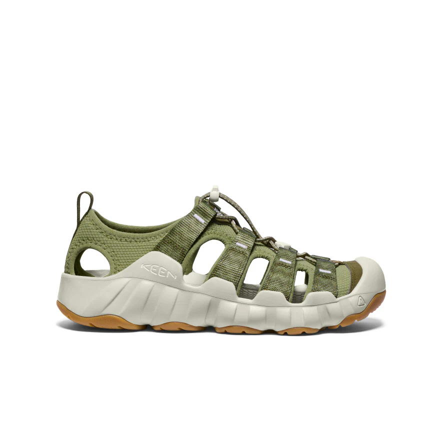 Green KEEN hiking sandal with closed toe, multiple straps and rugged white sole, side view.