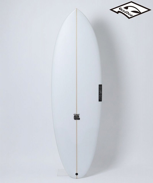 White surfboard standing upright on a light background, features a brown stringer and small brand logos along the deck.