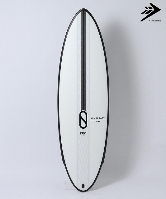 s-MINDCRAFT_PRO - SHOP NEWS | ムラサキスポーツオンラインストア 通販 White surfboard with black rails standing upright against a light background; features Mindcraft branding and a Firewire logo in the corner.