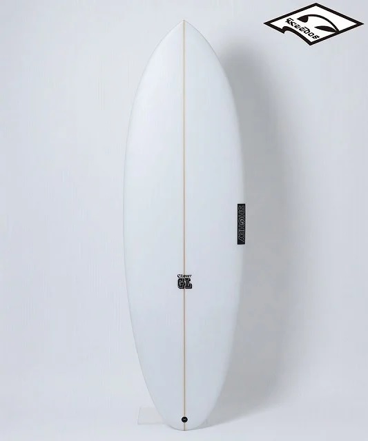 White surfboard standing upright against a light background, with a central stringer and small brand logos along the center area.