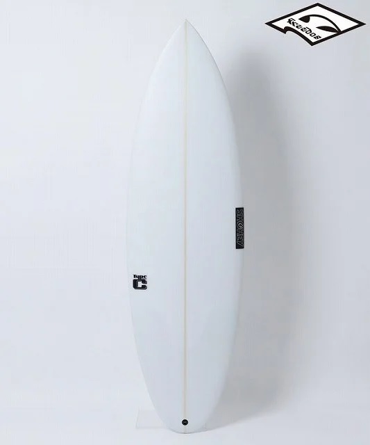 White surfboard standing upright on a small stand, with a thin beige center stringer and small black logos along the body.