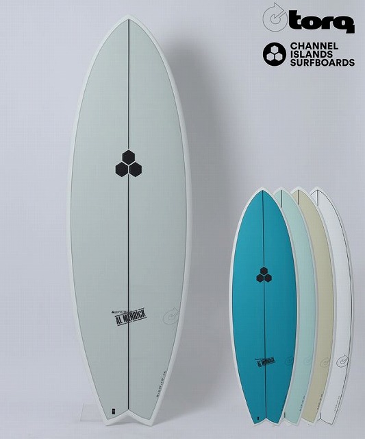 Tall light-gray surfboard standing upright with a black honeycomb logo, alongside four smaller teal, blue, cream, and white boards; Torq and Channel Islands logos visible in top-right corner.