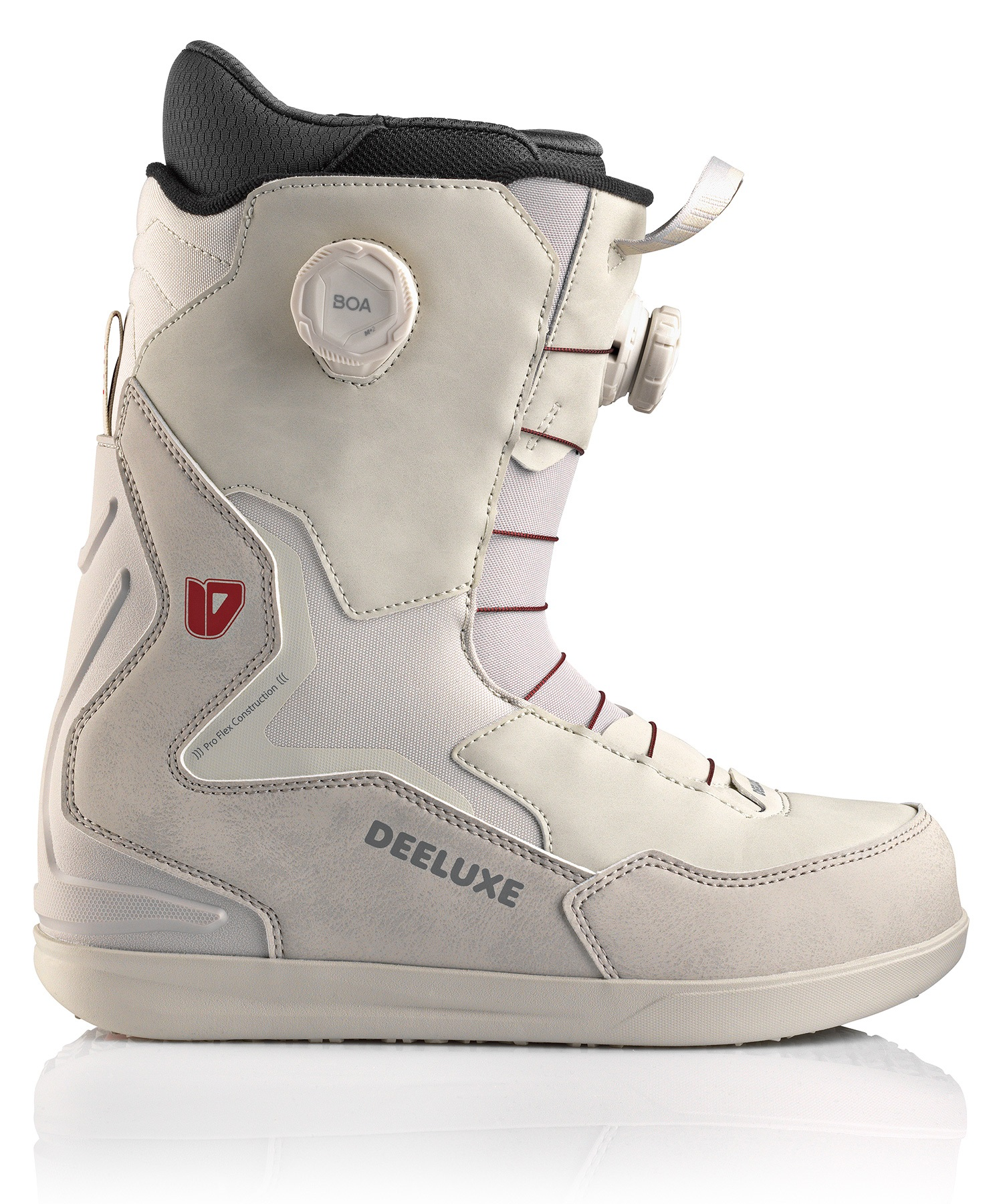 Beige snowboard boot with a white BOA dial on the side and a black padded collar; gray sole and Deeluxe branding visible on the side.