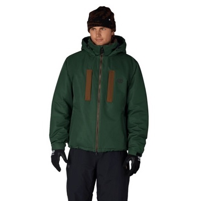 Man wearing a dark green waterproof winter jacket with a hood, brown vertical zipper panels, black gloves, and dark pants against a white background.