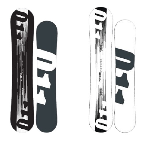 Two snowboards standing upright next to each other, one black with gray graphic and the other white with a black graphic.