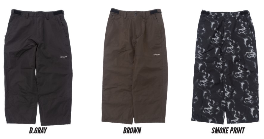 スクリーンショット 2026-05-20 172908 - SHOP NEWS | ムラサキスポーツオンラインストア 通販 Three knee-length outdoor shorts in dark gray, brown, and black smoke‑print camouflage, each with belt loops, zip fly, side pockets, and a small brand logo on the left thigh.