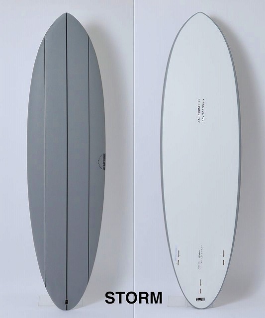 BIG BARON SOFT 3 - SHOP NEWS | ムラサキスポーツオンラインストア 通販 Two views of a Storm surfboard: gray top deck with a dark center stringer on the left, white bottom with logos on the right.
