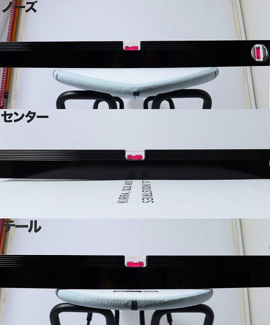 BIG BARON SOFT 6 - SHOP NEWS | ムラサキスポーツオンラインストア 通販 Close-up of a pale blue curved seat with black metal supports, framed by black display bars and white panels with pink connectors.