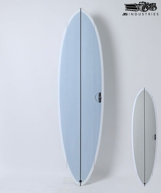 BIG BARON1 - SHOP NEWS | ムラサキスポーツオンラインストア 通販 Two surfboards leaning against a white wall: a tall light-blue board in front and a smaller gray board behind, with a JB Industries logo in the top-right corner.