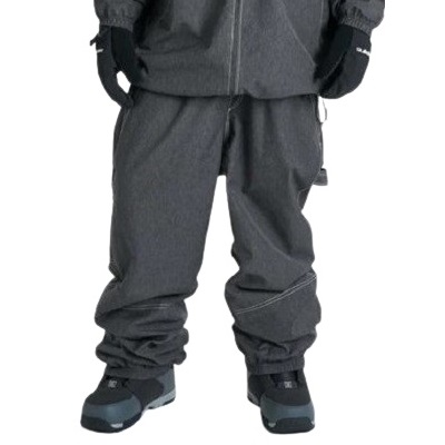 Lower half of a person wearing dark insulated snow pants, gloves, and rugged winter boots.