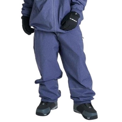 Lower body of a person wearing blue snow pants, black gloves, and winter boots, standing with feet apart.