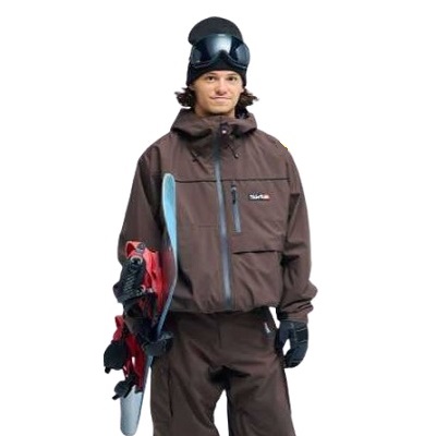 Snowboarder in brown snowsuit with helmet and goggles, holding a snowboard under one arm against a white background