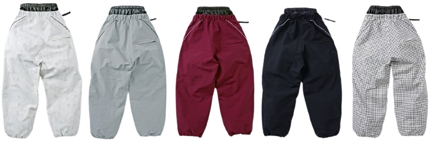 Five loose-fitting pants displayed in a row: white, light gray, burgundy, navy, and black-and-white checkered patterns, each with an elastic waistband and drawstring.