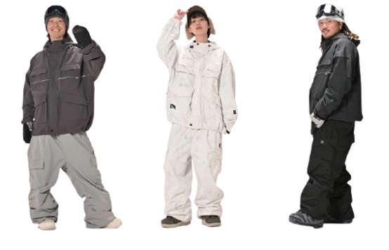 Three people modeling oversized snowboarding outfits: gray suit on left, white suit in middle, and black suit on right, with helmets and gloves.