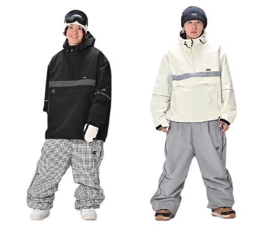 Two people wearing winter ski outfits: left in a black jacket with reflective stripe and checkered snow pants; right in a white jacket with gray stripe and gray pants, both with beanies and gloves.